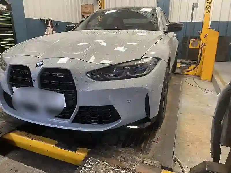 A performance BMW raised on the ramp inside the M&S Garage workshop