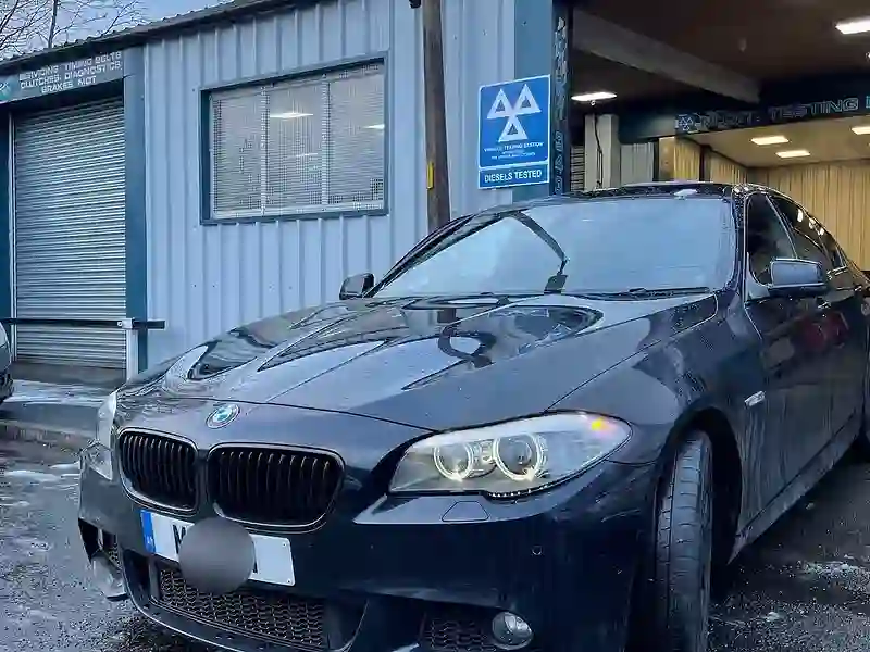 A BMW saloon outside the M&S Garage MOT station in Ashton-under-Lyne