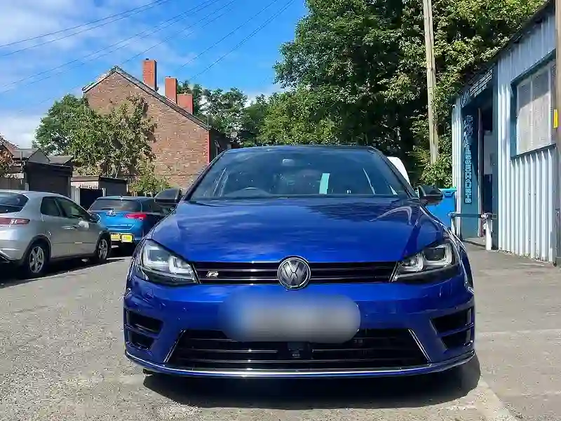 A blue Volkswagen Golf R outside the M&S Garage unit